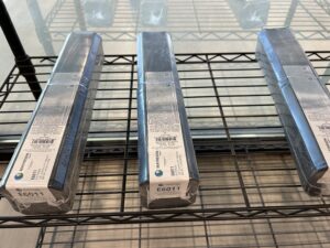 boxes of welding electrodes on wire shelf
