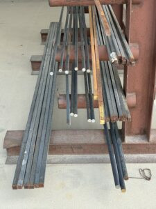 round and square bar on outdoor metal rack